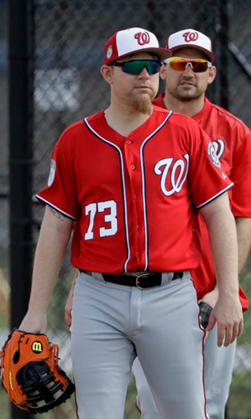 Happy to have a 'J-O-B,' Lind lands in camp with Nationals